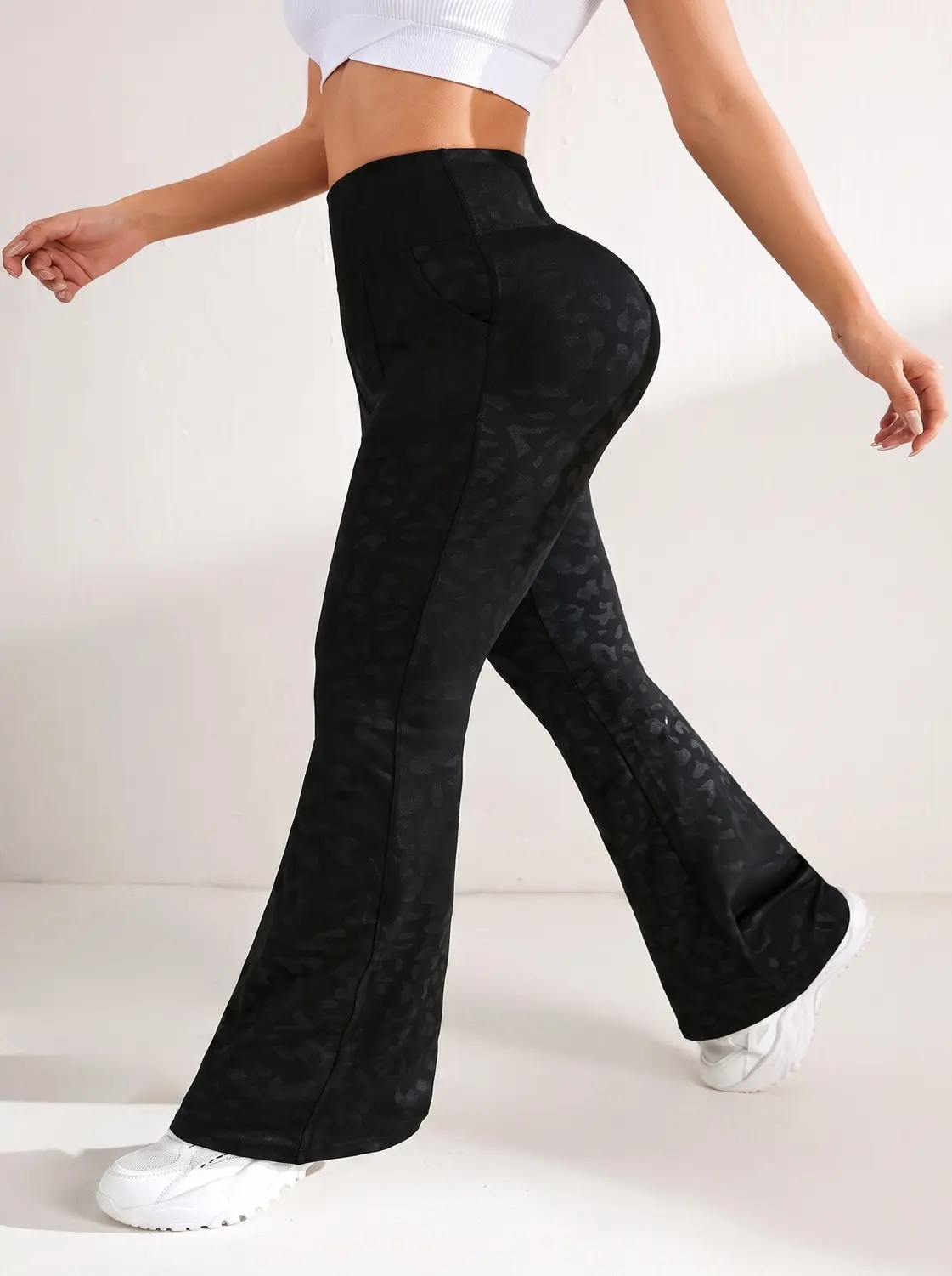 Shadow leopard high-waisted flared yoga pants – wide-bell flare detail