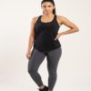 Woman wearing the black racerback gym tank in the studio