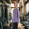 Criss-cross back athletic long sleeve top worn by a fitness model in the gym