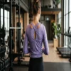 Athletic long sleeve top with criss-cross back, full length view