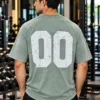 Sage green oversized graphic t-shirt with distressed 00 back print