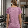 Back view of the Amour striped-sleeve athletic tee showing heart print and striped raglan sleeves Back view of the Amour striped-sleeve athletic tee showing heart print and striped raglan sleeves