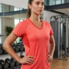 Vibrant Energy V-neck mesh-back active tee in coral for women, front view with V-neckline Vibrant Energy V-neck mesh-back active tee in coral for women, front view with V-neckline