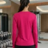 Back view of the magenta Aura Luxe V-neck performance long-sleeve top