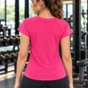 Back view of the Aura Luxe classic pink performance tee showing raglan short sleeves Back view of the Aura Luxe classic pink performance tee showing raglan short sleeves