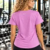 Back view of the pre-loved lilac Nike Dri-FIT statement tee with curved hem Back view of the pre-loved lilac Nike Dri-FIT statement tee with curved hem