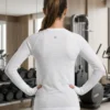 Back view of the pre-loved white Lululemon Swiftly Tech long sleeve shirt with reflective logo Back view of the pre-loved white Lululemon Swiftly Tech long sleeve shirt with reflective logo