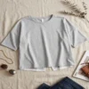 Make_picture_good_quality_2K_20261018144949 Back view of the split-back hem on the relaxed fit cropped athletic tee
