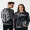 Man_and_woman_wearing_t-shirt_2K_20261016193500 Man and woman wearing the Y2K gothic winged cross tee