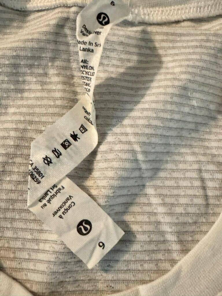 Pre-loved Lululemon Swiftly Tech long sleeve shirt care label showing size 6