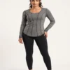 Woman_posing_in_athletic_shirt_2K_20261018181952 Contoured seam athletic long sleeve top in heather grey, front view