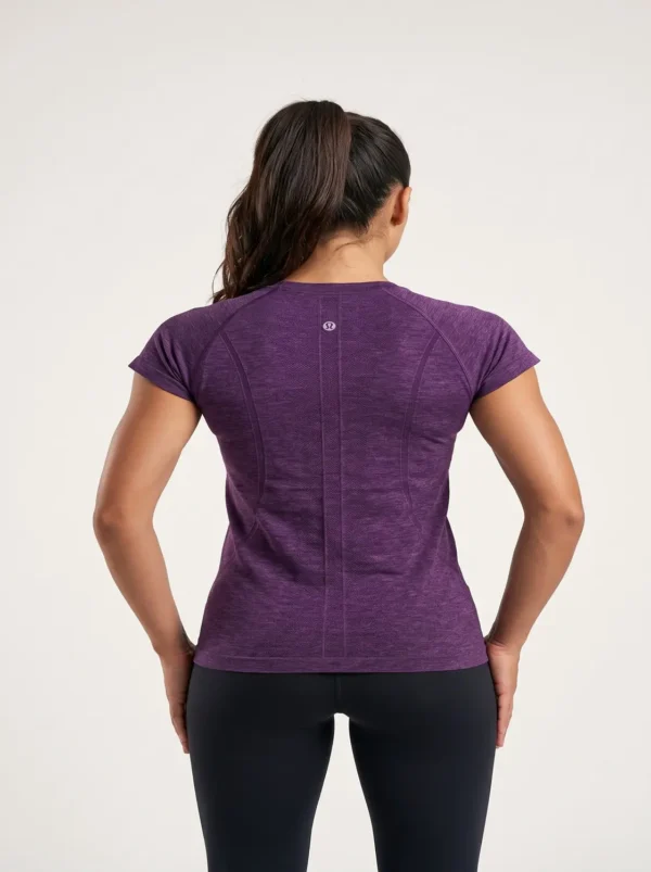 Woman_posing_in_athletic_shirt_2K_20261018191254 Side view of the purple Lululemon Swiftly Tech 2.0 running shirt