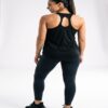 Racerback strap detail on the black athletic tank top