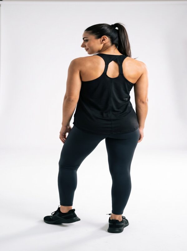 Racerback strap detail on the black athletic tank top