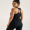 Black racerback athletic tank top worn by a fitness model