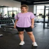 Woman_standing_in_gym_2K_20261015202116 Lavender Glow Textured Active Tee worn by woman in gym